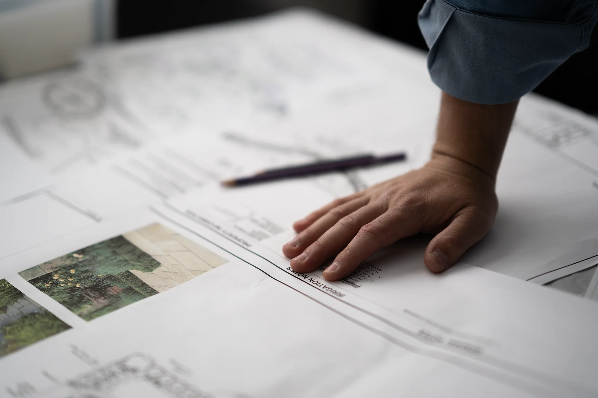 A Green Landscape Solutions employee designing a landscape for a client in Boulder, Colorado.